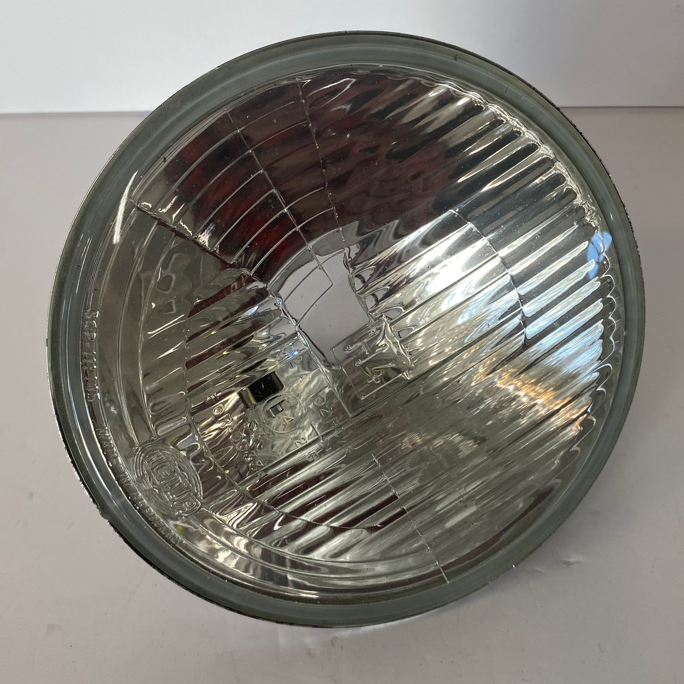 Optique de phare Hella 7 pouces Harley Davidson REF MCS 908165