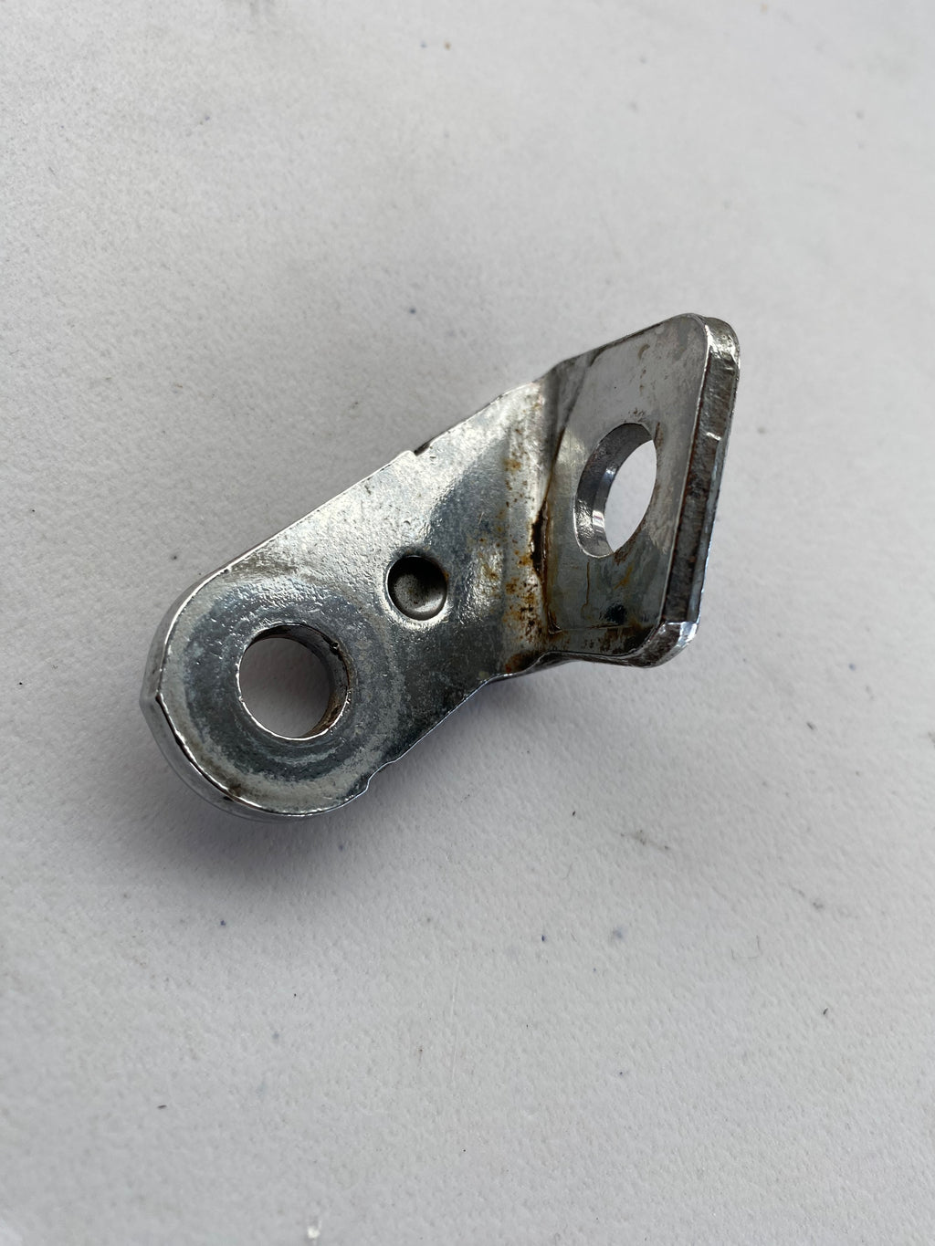Patte de fixation de collecteur arrière Sportster Harley Davidson REF OEM : 65974-04A