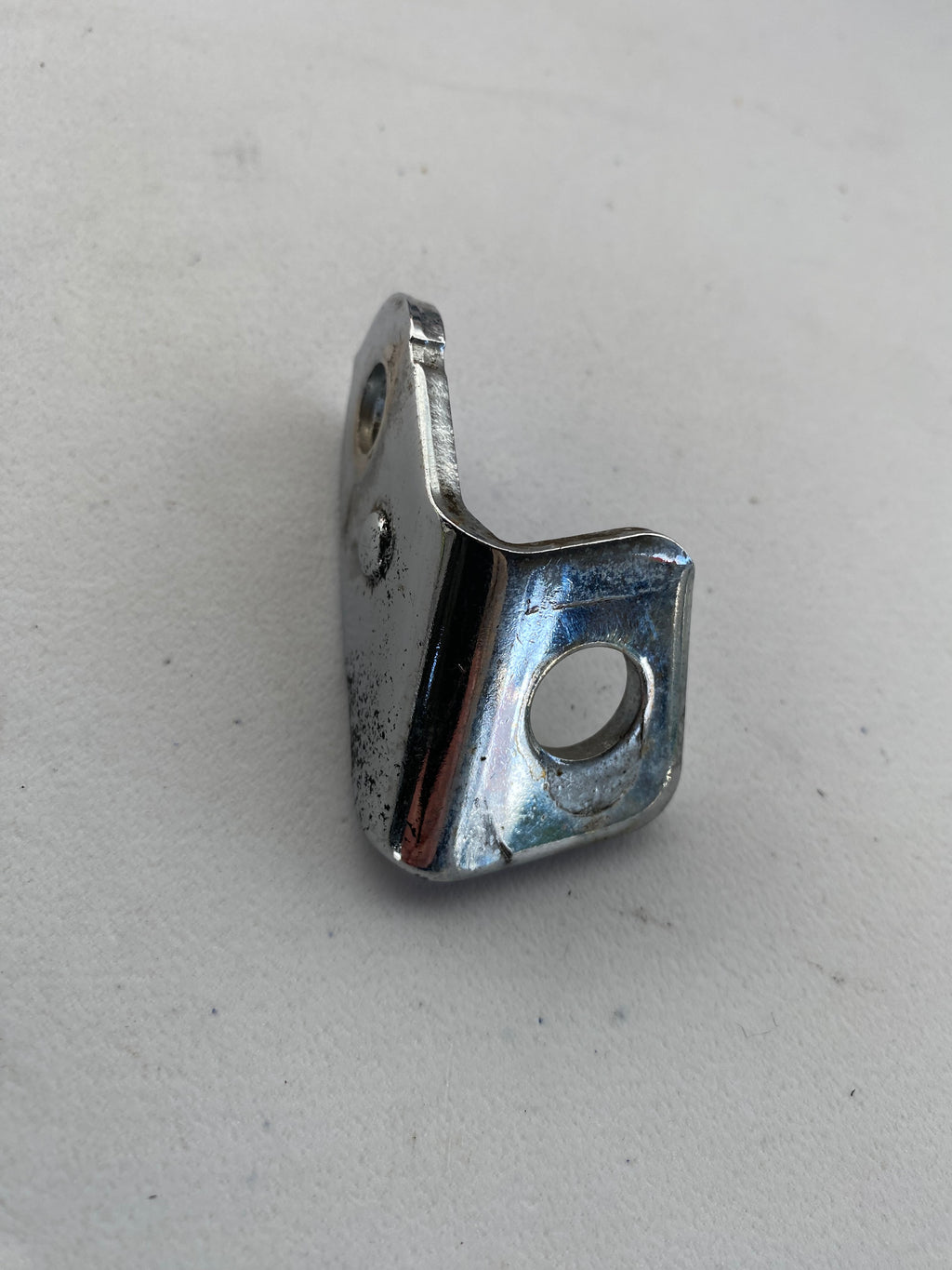 Patte de fixation de collecteur arrière Sportster Harley Davidson REF OEM : 65974-04A