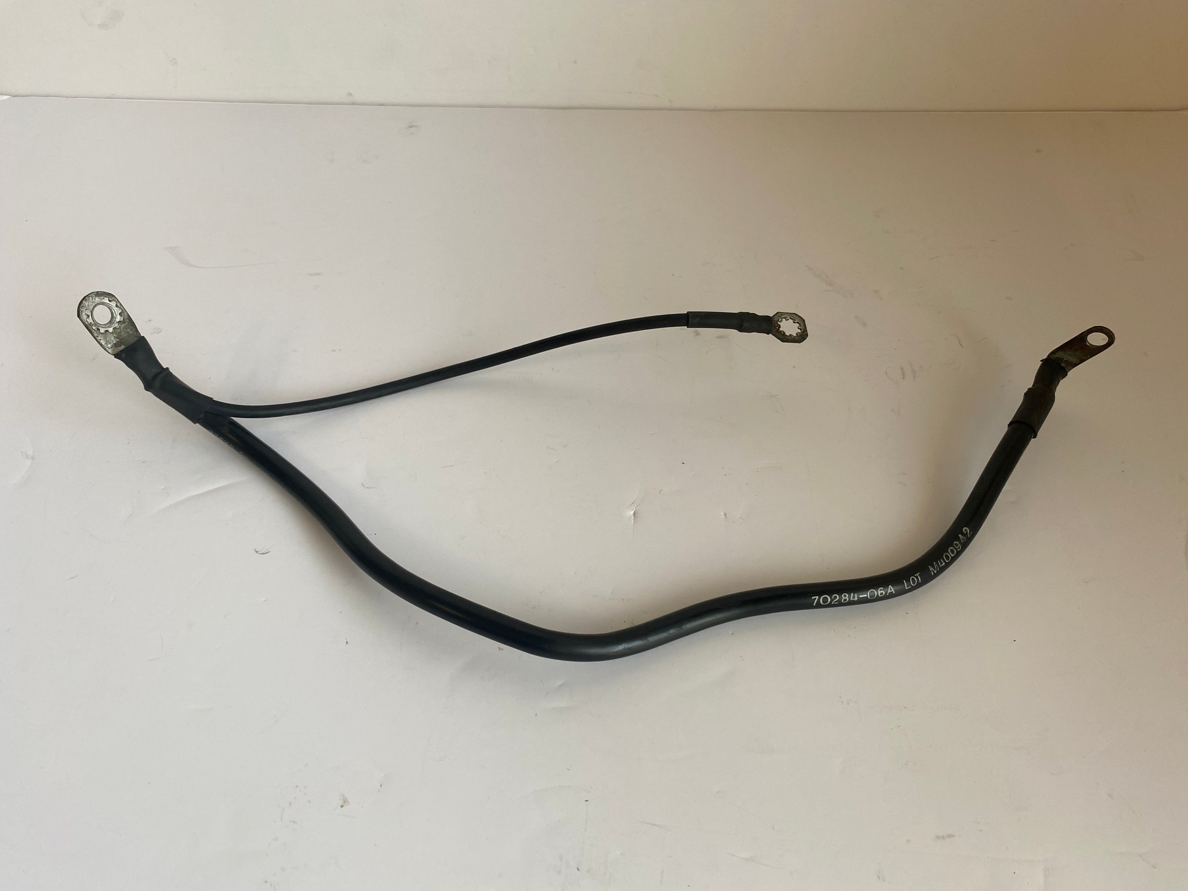 Cable de batterie négatif Dyna Harley Davidson REF OEM 70284-06A