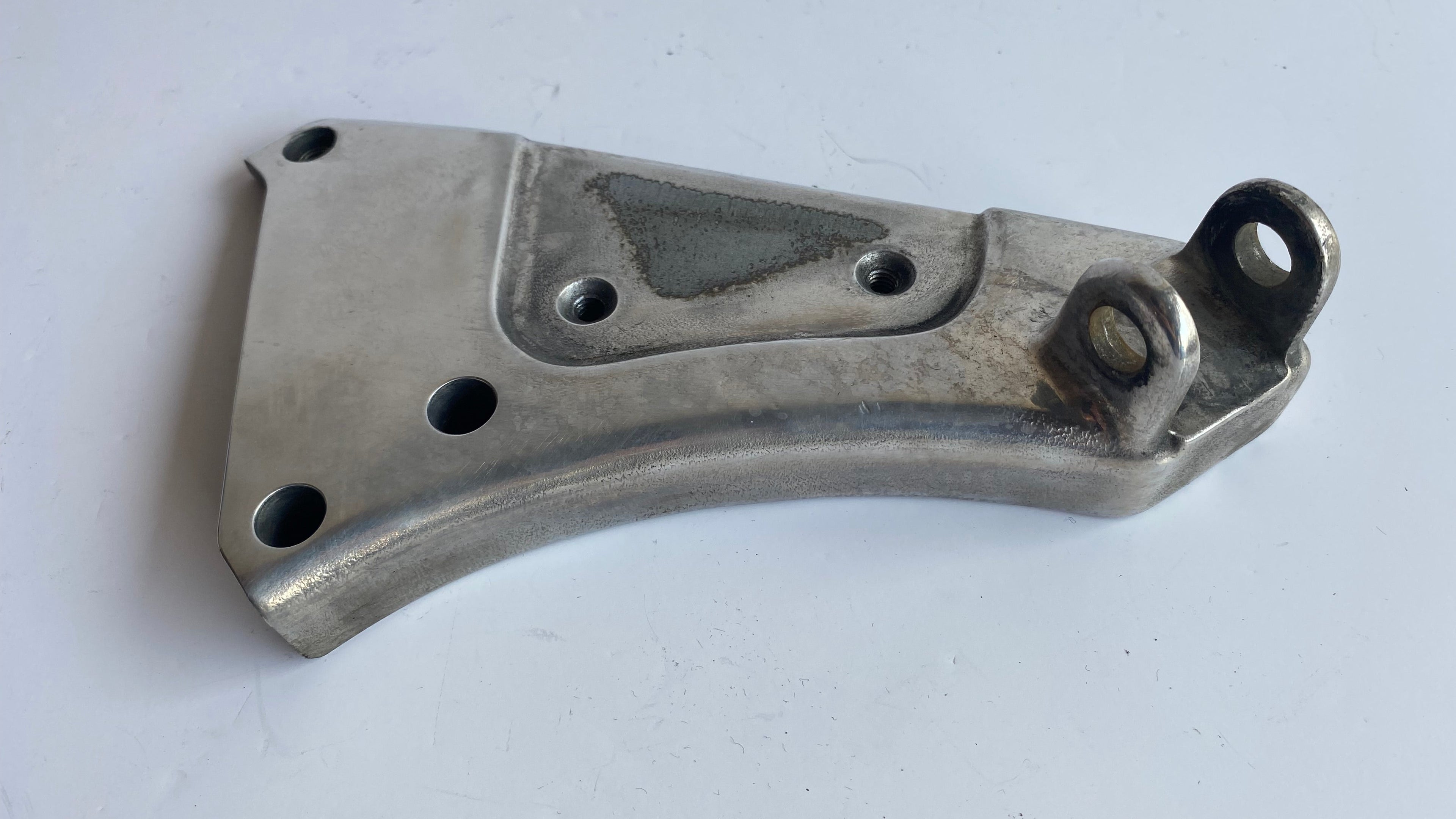 Support de cale pied pilote gauche Buell XB REF OEM : N0402.02A8